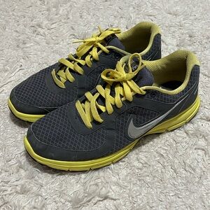 Gray and yellow Nike sneakers